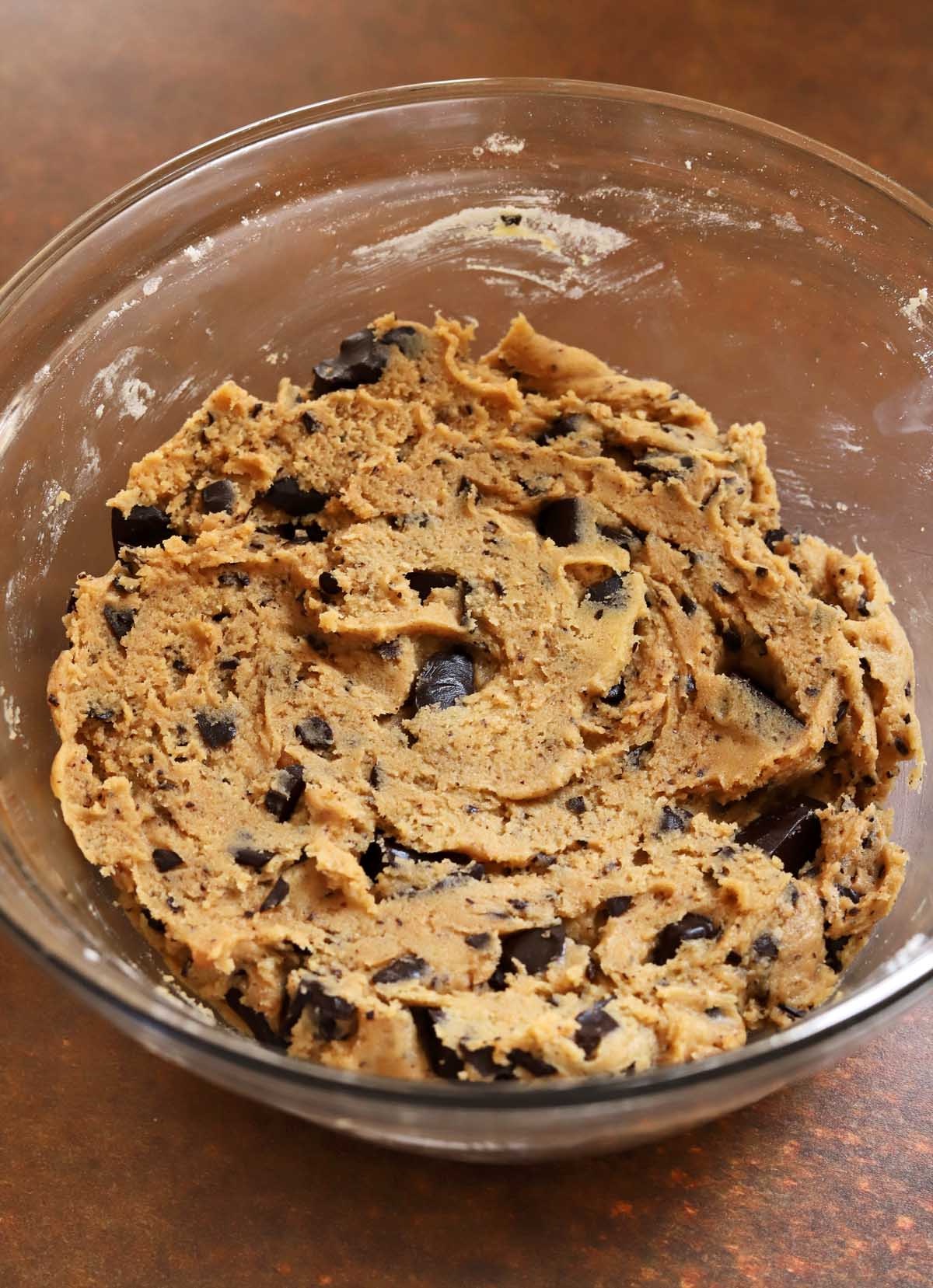 Cookie dough in mixing bowl with chocolate chips